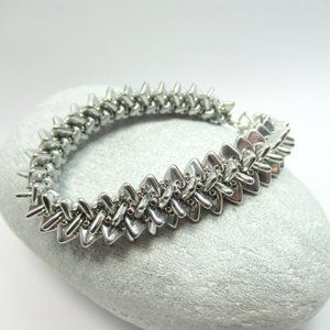 Handwoven spiky silver triangle bracelet